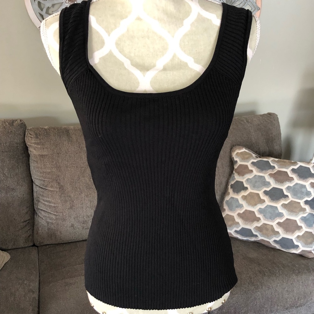 Stretchy ribbed tank. Very comfy and flattering.